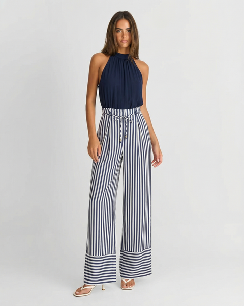 Adeline | Halter Neck Self-Tie Waist Stripe Flowing Wide-Leg Jumpsuit in Navy