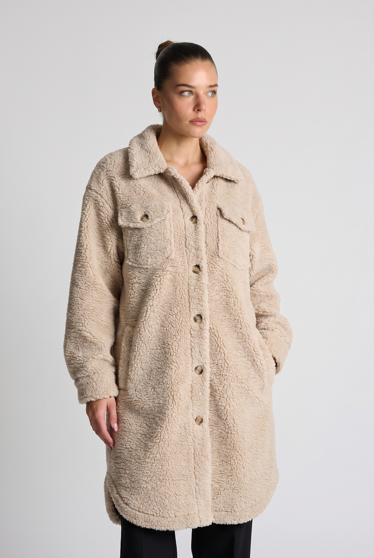 NOLA model wearing beige oversized sherpa coat