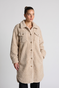 NOLA model wearing beige oversized sherpa coat