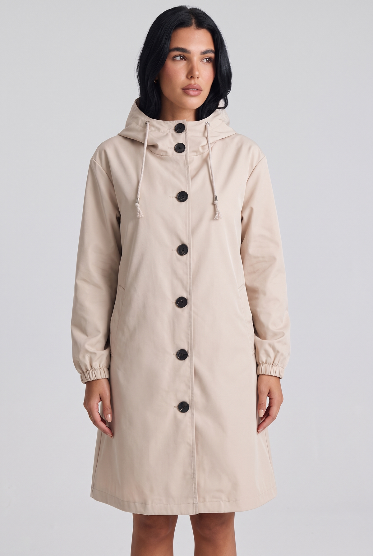 NOLA model wearing hooded A-line button front coat