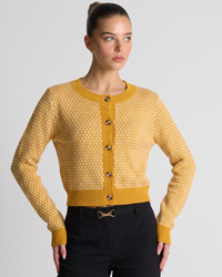 NOLA model wearing yellow button-front long sleeve cardigan