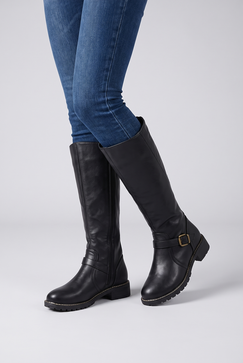 NOLA model wearing leather buckle boots