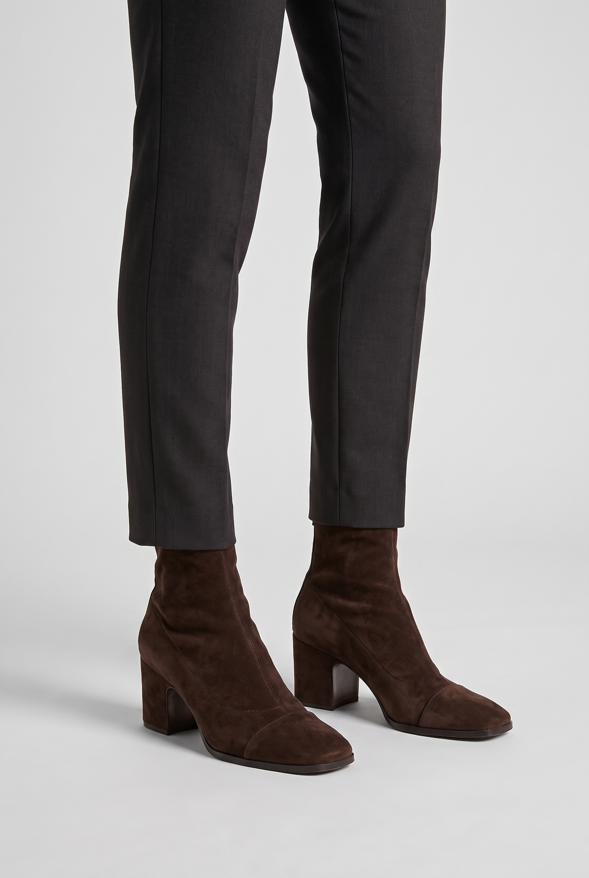 NOLA model wearing suede block heel ankle boots dark brown
