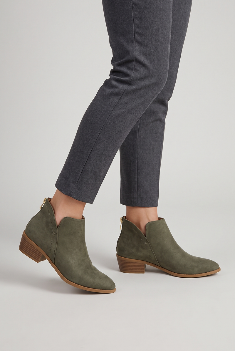 NOLA model wearing pointed toe ankle boots
