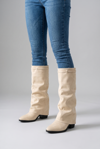 NOLA model wearing mid-calf slouch block heel boots