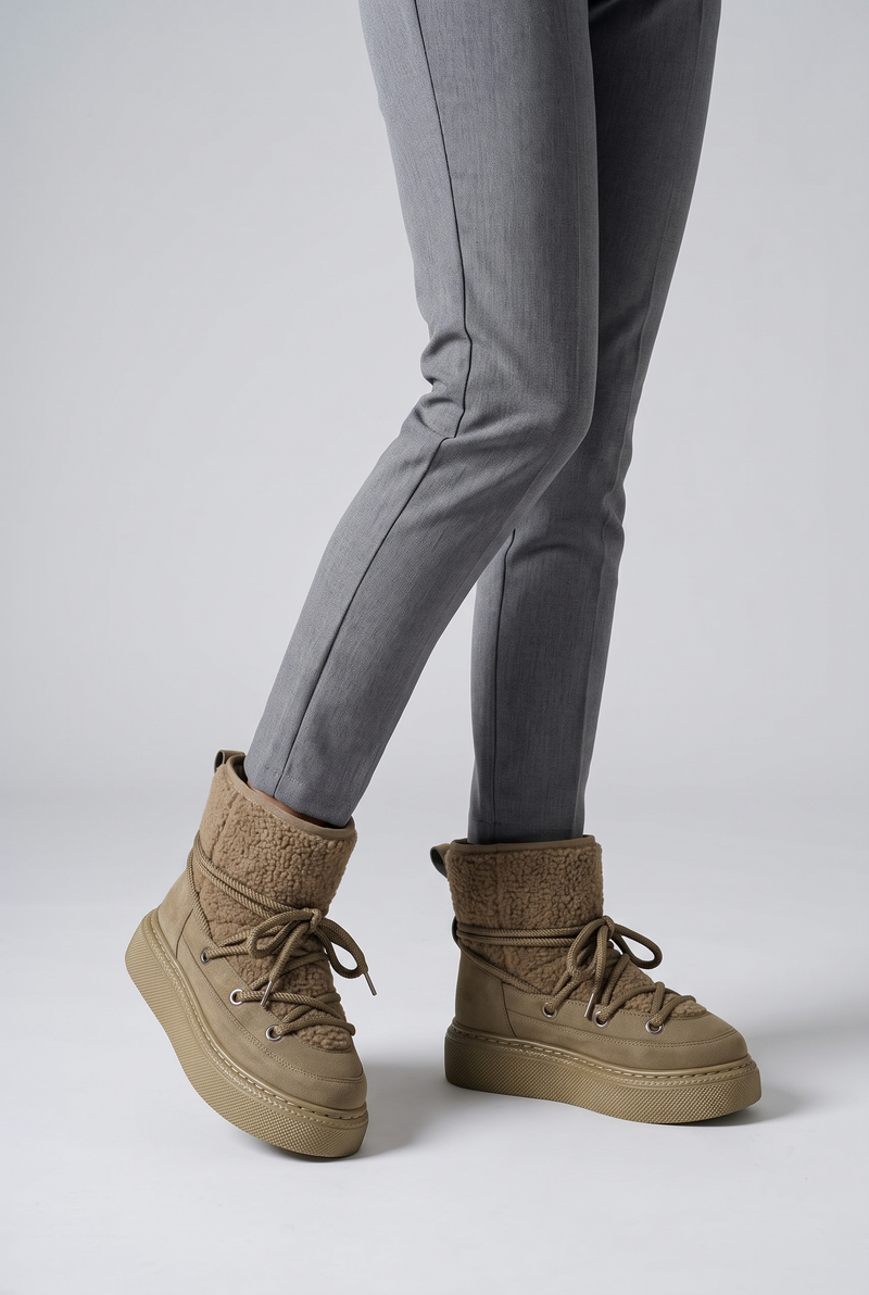 NOLA model wearing lace-up platform ankle boots
