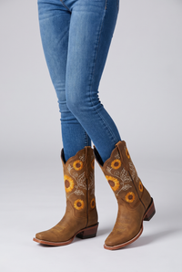 NOLA model wearing mid-calf boots