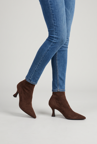 NOLA model wearing pointed toe kitten heel ankle boots