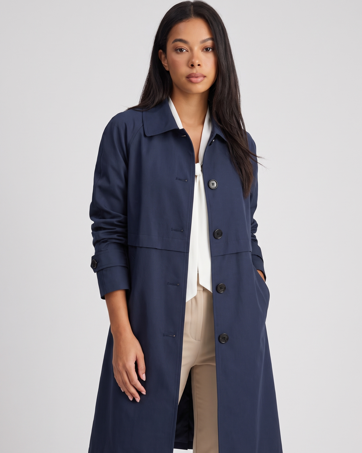 NOLA model wearing button-front mid-length trench coat dark blue and black